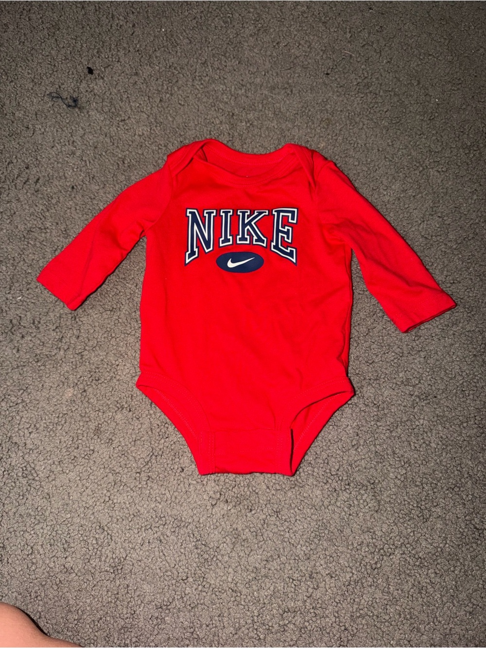 Nike Long-Sleeve Baby One-Piece in Vibrant Red with Navy Logo